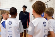 Dallas Mavericks player Olivier-Maxence Prosper visits with kids at Hoop Camp at the...