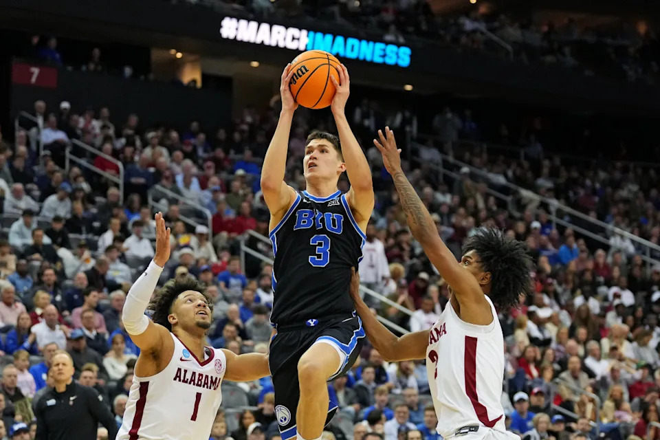 Brigham Young Cougars guard Egor Demin (3) drives to the basket against Alabama Crimson Tide guard Mark Sears (1) during the second half during an East Regional semifinal of the 2025 NCAA tournament at Prudential CenterRobert Deutsch-Imagn Images