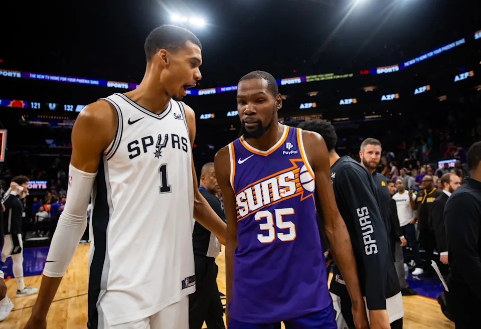 San Antonio Spurs center Victor Wembanyama (1) and Phoenix Suns forward Kevin Durant (35).Mark J&period; Rebilas-Imagn Images