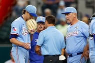 Texas Rangers starting pitcher Jacob deGrom (48) talks with head athletic trainer Matt...