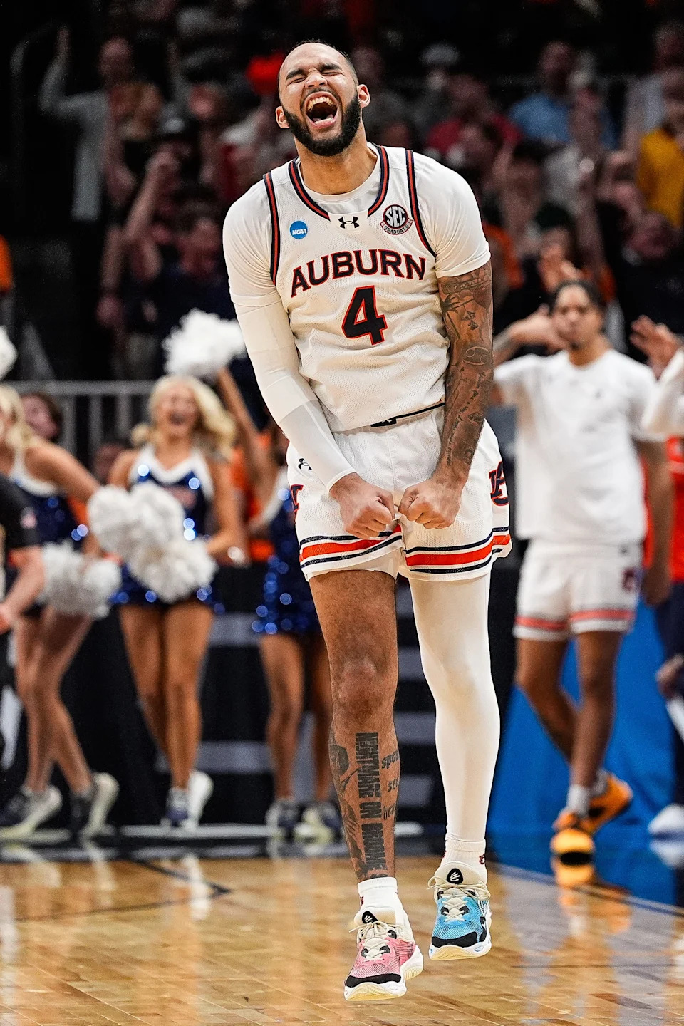 Johni Broome celebrates a play against Michigan State during the Elite Eight in Atlanta, March 30, 2025.
