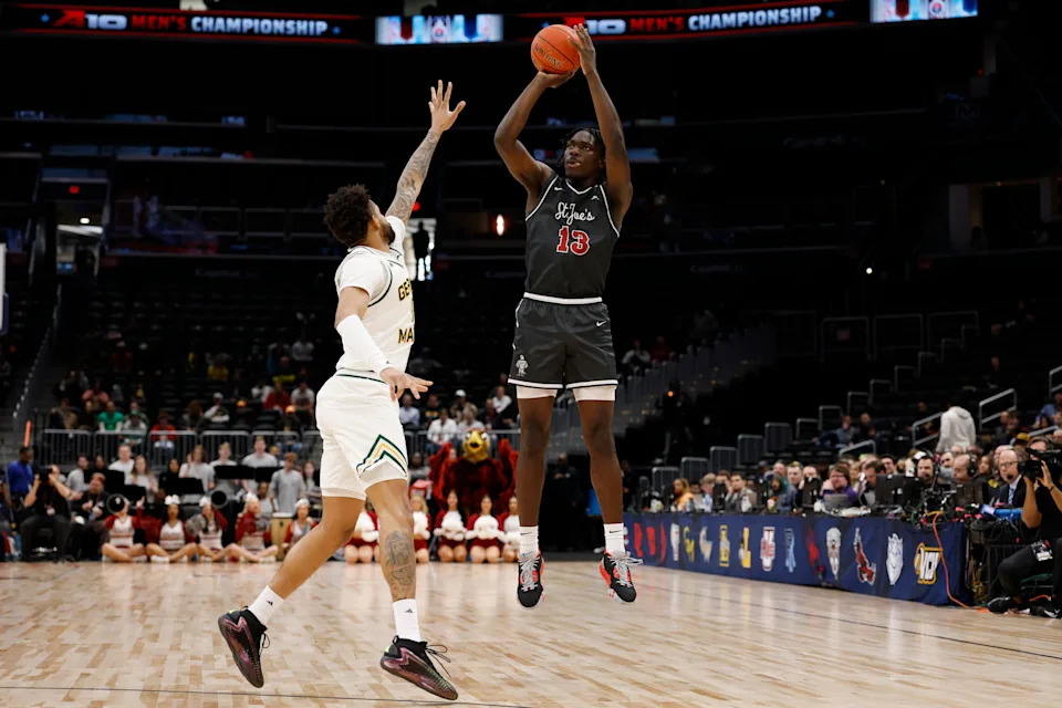 Mar 15, 2025; Washington, D.C., USA; Saint Joseph's Hawks forward Rasheer Fleming (13) shoots the ball over Saint Joseph's Hawks forward Shawn Simmons II (10) in the first half at Capital One Arena. Mandatory Credit: Geoff Burke-Imagn Images