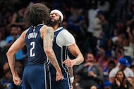 Dallas Mavericks forward Anthony Davis celebrates with center Dereck Lively II (2) after...