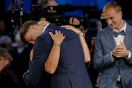 Cooper Flagg hugs family members after being selected first overall by the Dallas Mavericks...