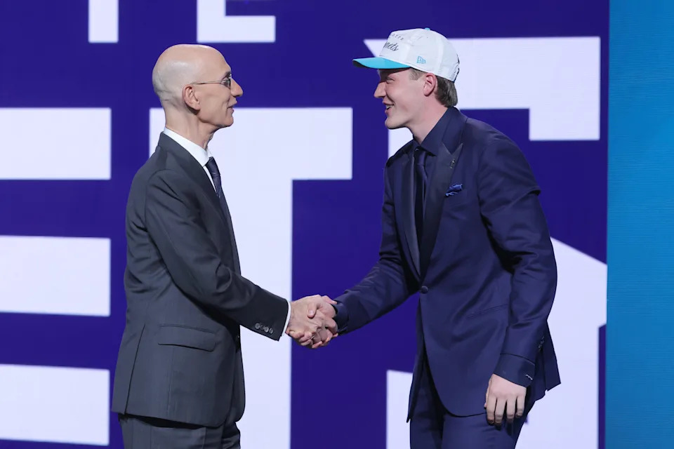 Jun 25, 2025; Brooklyn, NY, USA; Kon Knueppel shakes hands with NBA commissioner Adam Silver after being selected as the fourth pick by the Charlotte Hornets in the first round of the 2025 NBA Draft at Barclays Center. Mandatory Credit: Brad Penner-Imagn Images