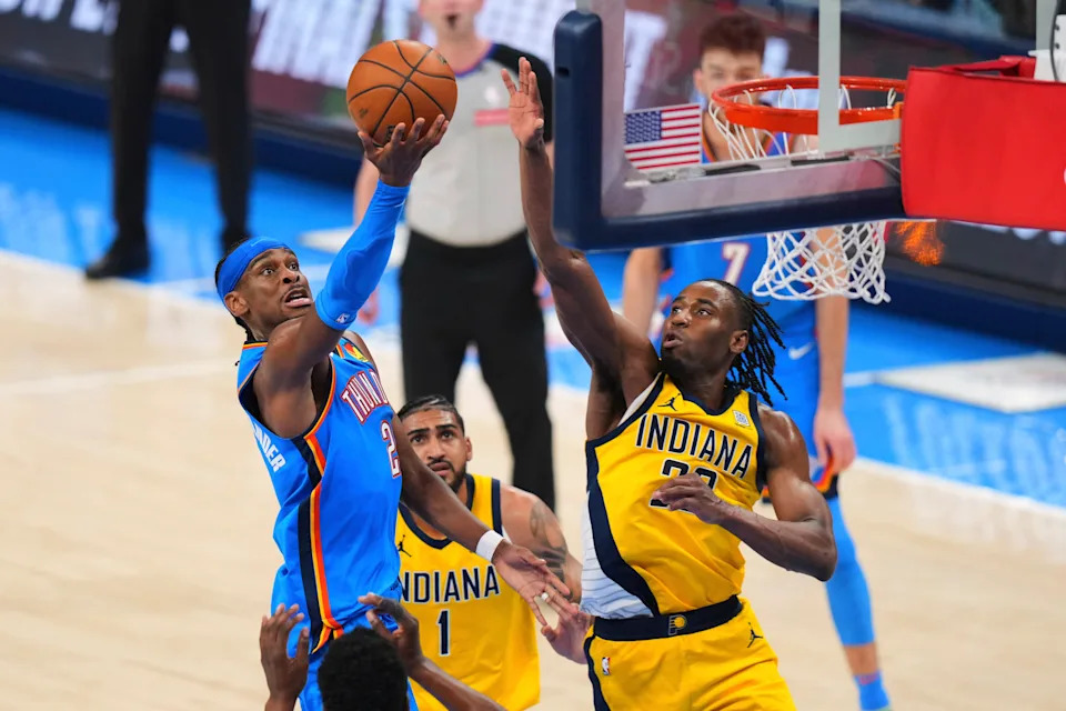 Oklahoma City Thunder guard Shai Gilgeous-Alexander (2) shoots against Indiana Pacers forward Aaron Nesmith (23) during the second half of Game 2 of the NBA Finals basketball series Sunday, June 8, 2025, in Oklahoma City. (AP Photo/Kyle Phillips)