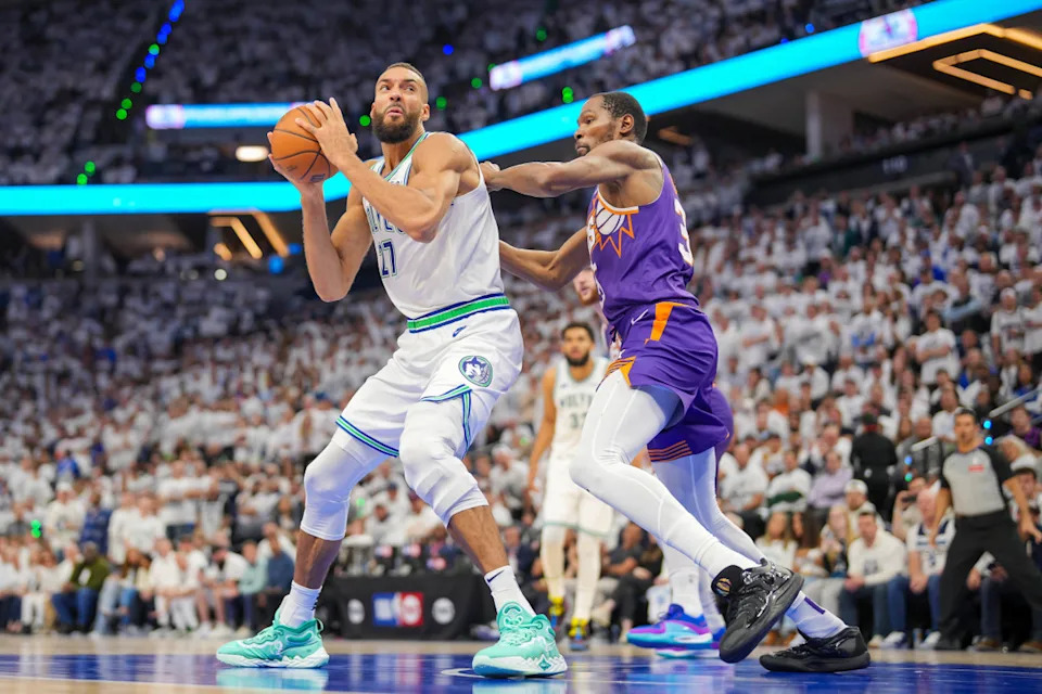 Phoenix Suns forward Kevin Durant (35) defends against Minnesota Timberwolves center Rudy Gobert (27)Credit&colon; Brad Rempel-Imagn Images