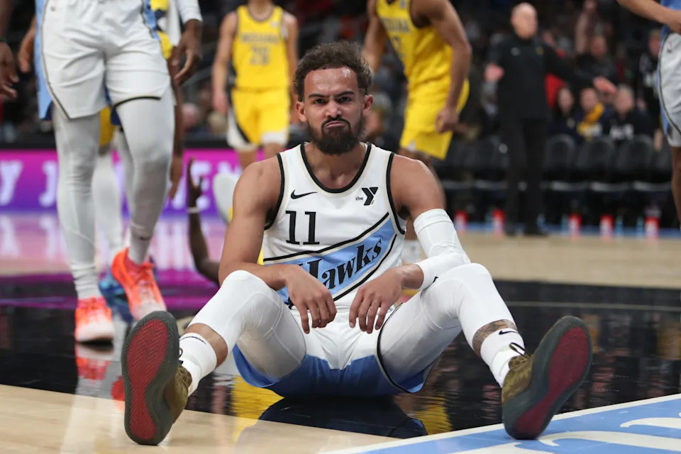 Atlanta Hawks guard Trae Young sits on the court after being fouled by Indiana Pacers forward Pascal Siakam.Mady Mertens-Imagn Images