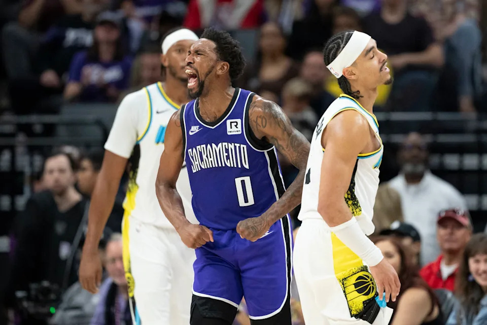 December 22, 2024; Sacramento, California, USA; Sacramento Kings guard Malik Monk (0) celebrates a defensive stop against Indiana Pacers guard Andrew Nembhard (2) during the second quarter at Golden 1 Center. © Kyle Terada-Imagn Images