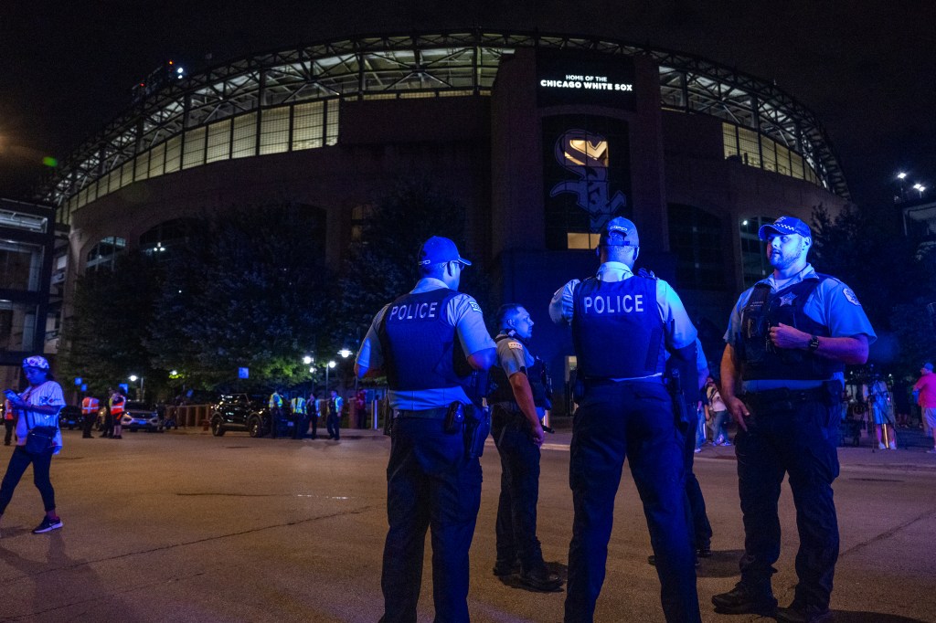 Police officers outside Guaranteed Rate Field after a shooting.