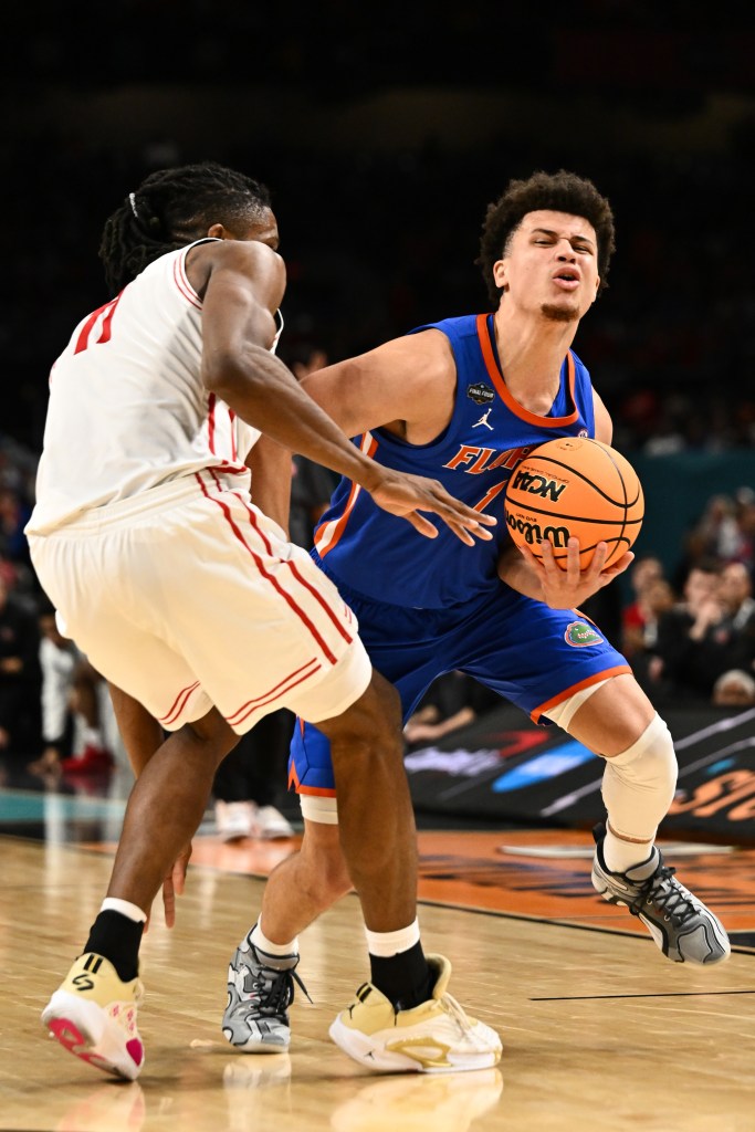 A basketball player dribbling the ball during a game.