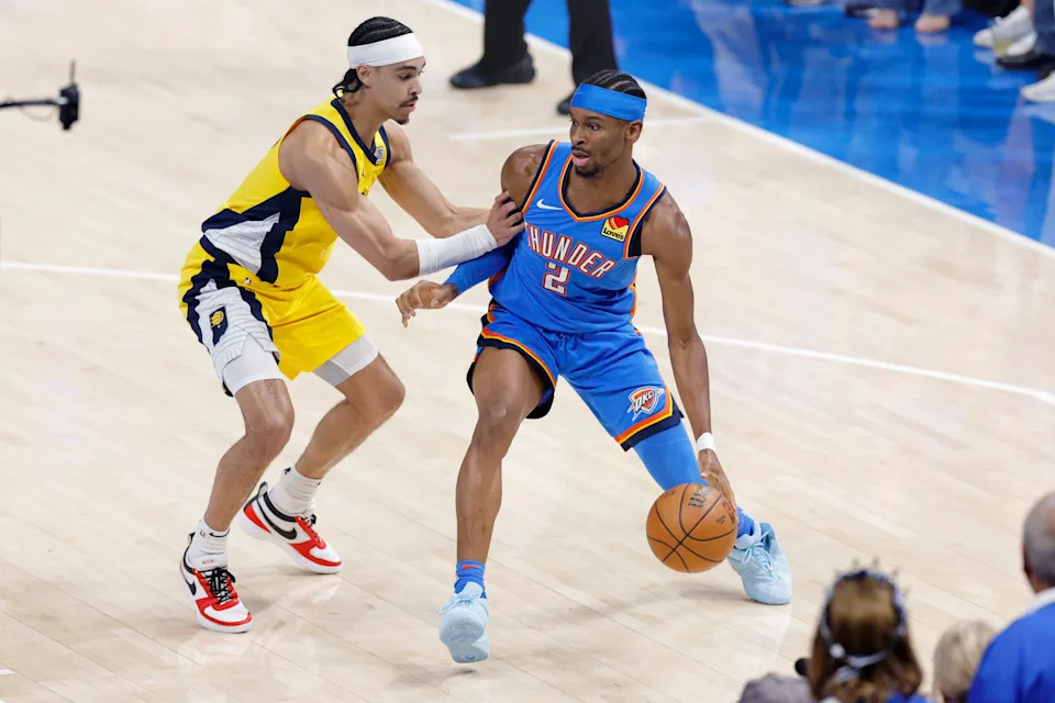 Jun 22, 2025; Oklahoma City, Oklahoma, USA; Oklahoma City Thunder guard Shai Gilgeous-Alexander (2) controls the ball againstIndiana Pacers guard Andrew Nembhard (2) during the first half of game seven of the 2025 NBA Finals at Paycom Center. Mandatory Credit: Alonzo Adams-Imagn Images