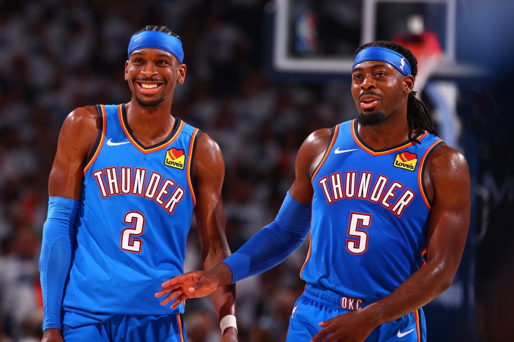 Shai Gilgeous-Alexander #2 & Luguentz Dort #5 of the Oklahoma City Thunder smile during the game against the Minnesota Timberwolves during Game Five of the Western Conference Finals on May 28, 2025 at Paycom Center in Oklahoma City, Oklahoma.