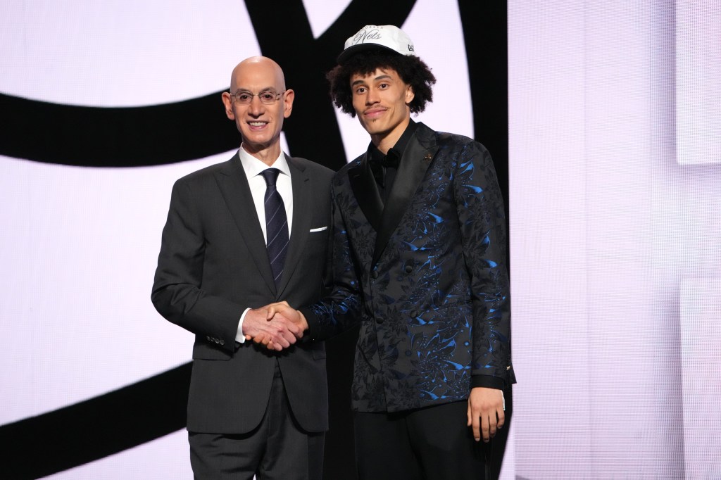 Adam Silver poses with Nolan Traore after he was drafted nineteenth overall by the Brooklyn Nets during the 2025 NBA Draft - Round One on June 25, 2025 at Barclays Center in Brooklyn, New York. 