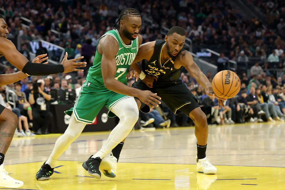 SAN FRANCISCO, CALIFORNIA - JANUARY 20: Jaylen Brown #7 of the Boston Celtics is guarded by Andrew Wiggins #22 of the Golden State Warriors during the first half at Chase Center on January 20, 2025 in San Francisco, California. NOTE TO USER: User expressly acknowledges and agrees that, by downloading and/or using this photograph, user is consenting to the terms and conditions of the Getty Images License Agreement. (Photo by Ezra Shaw/Getty Images)