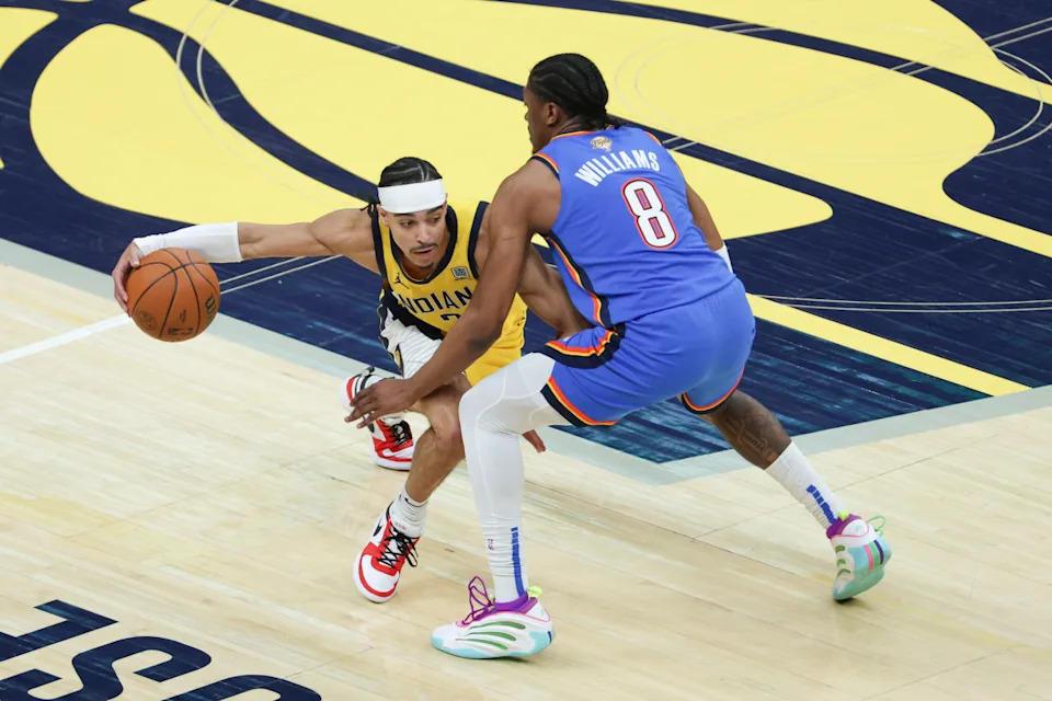 Jun 19, 2025; Indianapolis, Indiana, USA; Indiana Pacers guard Andrew Nembhard (2) dribbles defended by Oklahoma City Thunder forward Jalen Williams (8) in the first quarter during game six of the 2025 NBA Finals at Gainbridge Fieldhouse© Trevor Ruszkowski-Imagn Images