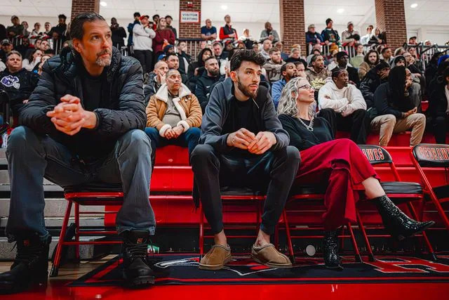Zach Beeker/NBAE via Getty Chet Holmgren with his parents.