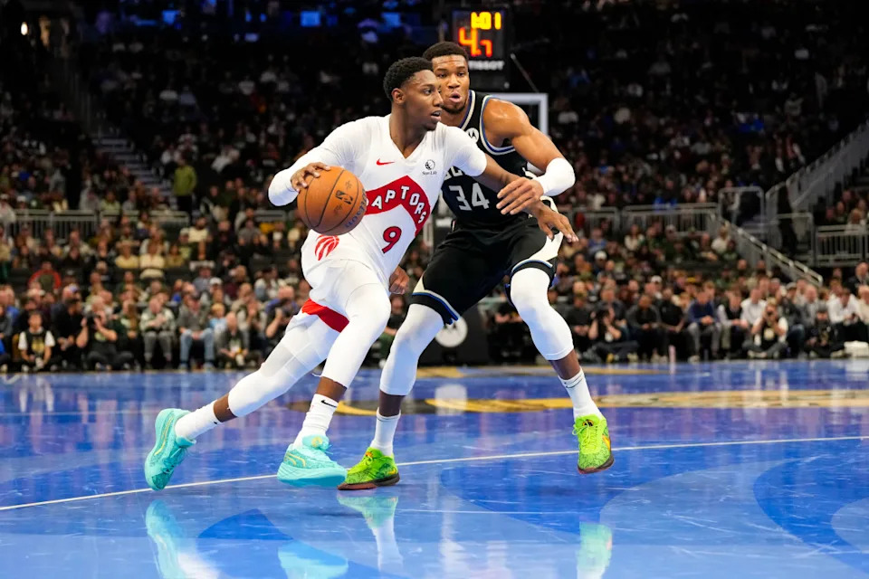 Toronto Raptors guard RJ Barrett (9) and Milwaukee Bucks forward Giannis Antetokounmpo (34).Jeff Hanisch-Imagn Images