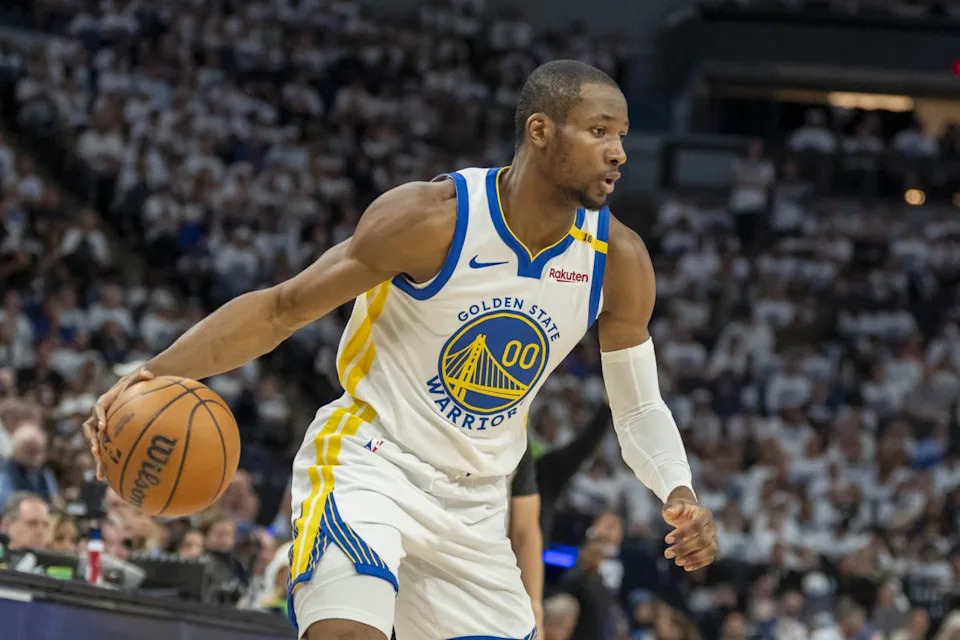 Golden State Warriors forward Jonathan Kuminga dribbles the ball during his team's playoff game against the Minnesota Timberwolves at Target Center on May 8, 2025.Jesse Johnson-Imagn Images