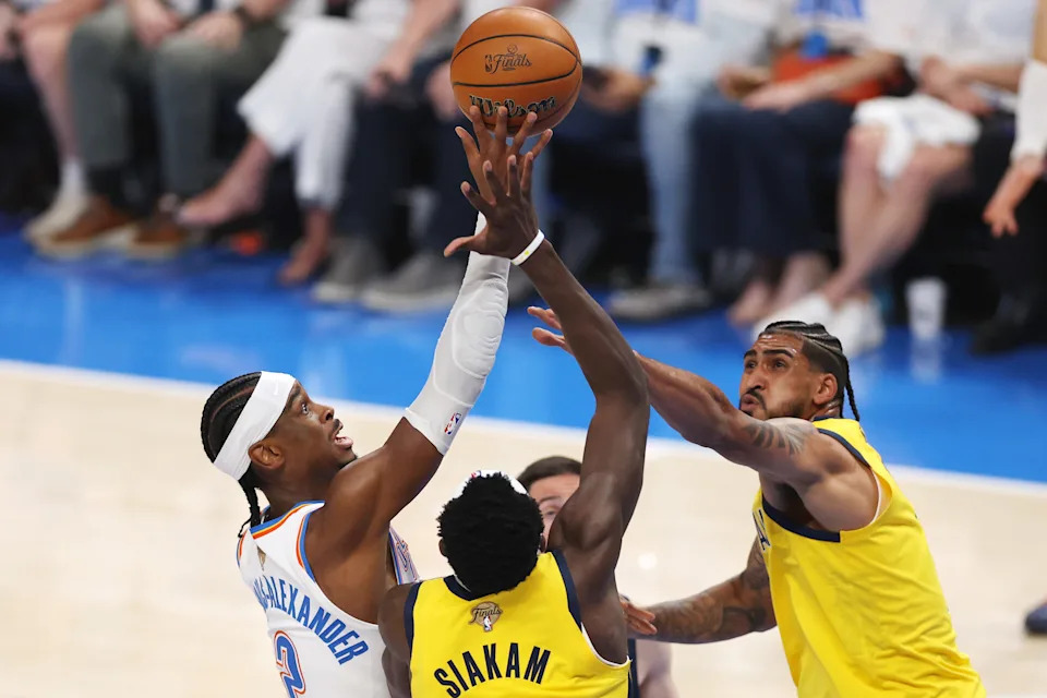 OKLAHOMA CITY, OKLAHOMA - JUNE 05: Shai Gilgeous-Alexander #2 of the Oklahoma City Thunder attempts a layup against Obi Toppin #1 and Pascal Siakam #43 of the Indiana Pacers during the first quarter in Game One of the 2025 NBA Finals at Paycom Center on June 05, 2025 in Oklahoma City, Oklahoma. NOTE TO USER: User expressly acknowledges and agrees that, by downloading and or using this photograph, User is consenting to the terms and conditions of the Getty Images License Agreement. (Photo by Matthew Stockman/Getty Images)