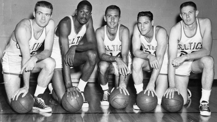 Boston, MA - 1/1/1960: From left, Boston Celtics players Tom Heinsohn, Bill Russell, Capt. Bob Cousy, Bill Sharman and Frank Ramsey pose together at the Boston Garden in Boston circa 1960. (Boston Globe Archive/) --- BGPA Reference: 170504_BS_001