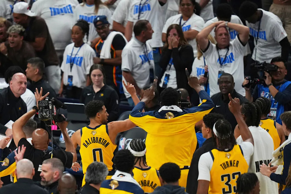 Indiana Pacers guard Tyrese Haliburton (0) and teammates celebrate as they leave the court after winning Game 1 of the NBA Finals basketball series against the Oklahoma City Thunder Thursday, June 5, 2025, in Oklahoma City. (AP Photo/Nate Billings)