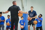 Dallas Mavericks first overall pick Cooper Flagg (right), participate in a Mavericks Academy...