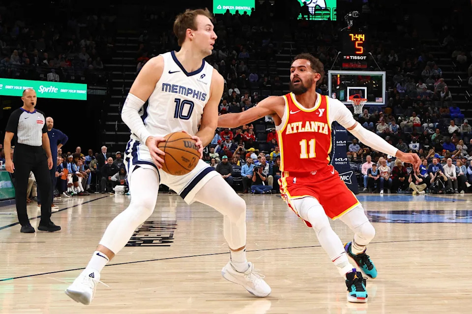 Mar 3, 2025; Memphis, Tennessee, USA; Memphis Grizzlies guard Luke Kennard (10) handles the ball as Atlanta Hawks guard Trae Young (11) defends during the third quarter at FedExForum. Mandatory Credit: Petre Thomas-Imagn Images Mandatory Credit: Petre Thomas-Imagn Images