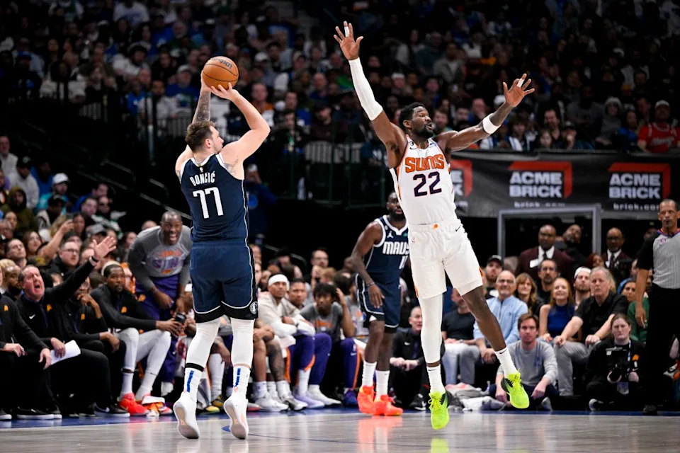 Former Dallas Mavericks guard Luka Doncic (77) and former Phoenix Suns center Deandre Ayton (22).Jerome Miron-USA TODAY Sports