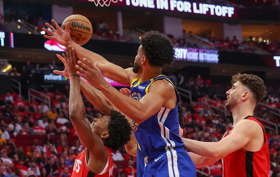 Apr 30, 2025; Houston, Texas, USA; Houston Rockets forward Amen Thompson (1) and Golden State Warriors forward Braxton Key (12) reach for a rebound in the fourth quarter during game five of first round for the 2025 NBA Playoffs at Toyota Center. Mandatory Credit: Thomas Shea-Imagn Images