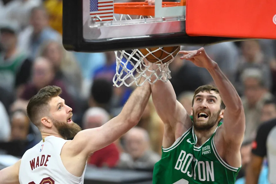 May 13, 2024; Cleveland, Ohio, USA; Boston Celtics center Luke Kornet (40) drunks beside Cleveland Cavaliers forward Dean Wade (32) in the first quarter of game four of the second round for the 2024 NBA playoffs at Rocket Mortgage FieldHouse.David Richard-USA TODAY Sports