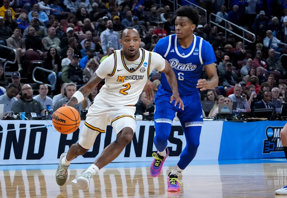 Missouri Tigers guard Tamar Bates (2) drives against Drake Bulldogs guard Tavion Banks (6) in the second half of a first round mens NCAA Tournament game at Intrust Bank Arena.Kirby Lee-Imagn Images