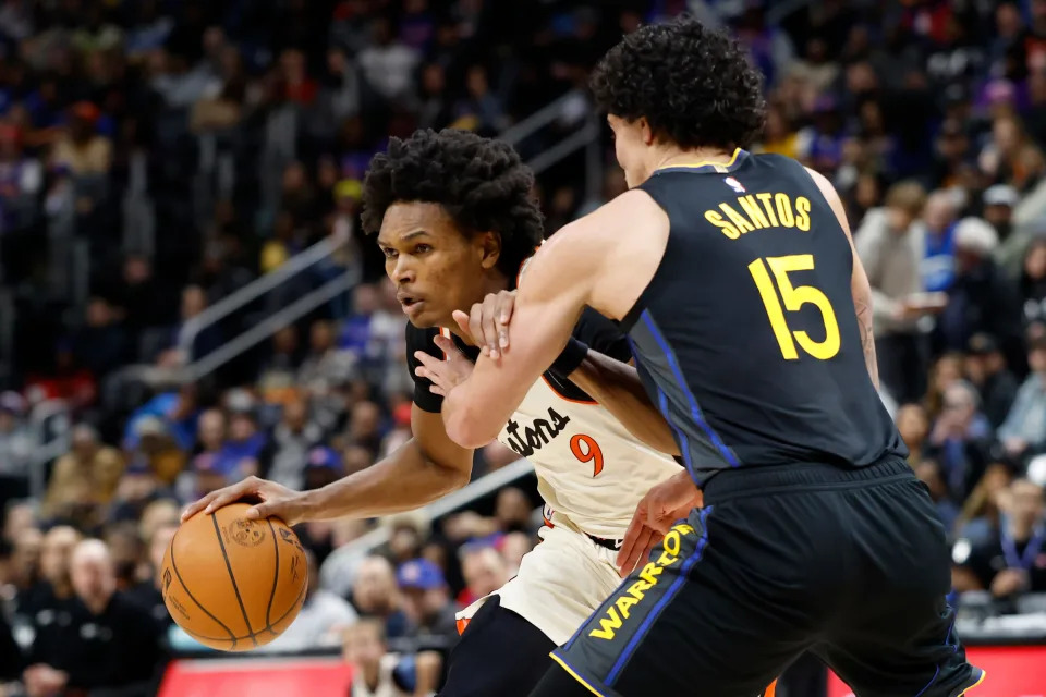 Jan 9, 2025; Detroit, Michigan, USA; Detroit Pistons forward Ausar Thompson (9) dribbles defended by Golden State Warriors forward Gui Santos (15) in the first half at Little Caesars Arena. Mandatory Credit: Rick Osentoski-Imagn Images
