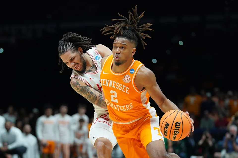 Tennessee Volunteers guard Chaz Lanier dribbles against Houston Cougars guard Emanuel Sharp in the first half during the Elite Elite of the NCAA tournament at Lucas Oil Stadium in Indianapolis on Sunday, March 30, 2025.