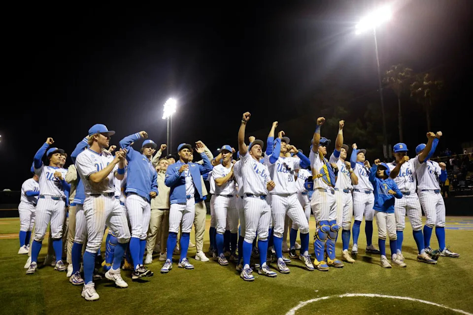 UCLA players and coaches celebrate after their Los Angeles Regional victory over UC Irvine on Sunday.