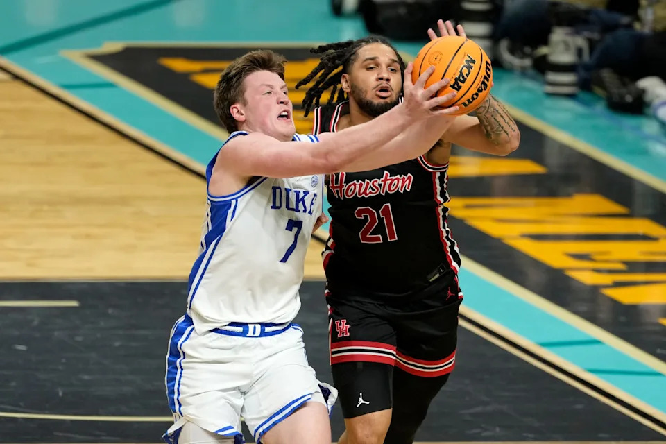 Apr 5, 2025; San Antonio, TX, USA; Duke Blue Devils guard Kon Knueppel (7) and Houston Cougars guard Emanuel Sharp (21) attempt to get a loose ball during the second half in the semifinals of the men's Final Four of the 2025 NCAA Tournament at Alamodome. Mandatory Credit: Scott Wachter-Imagn Images