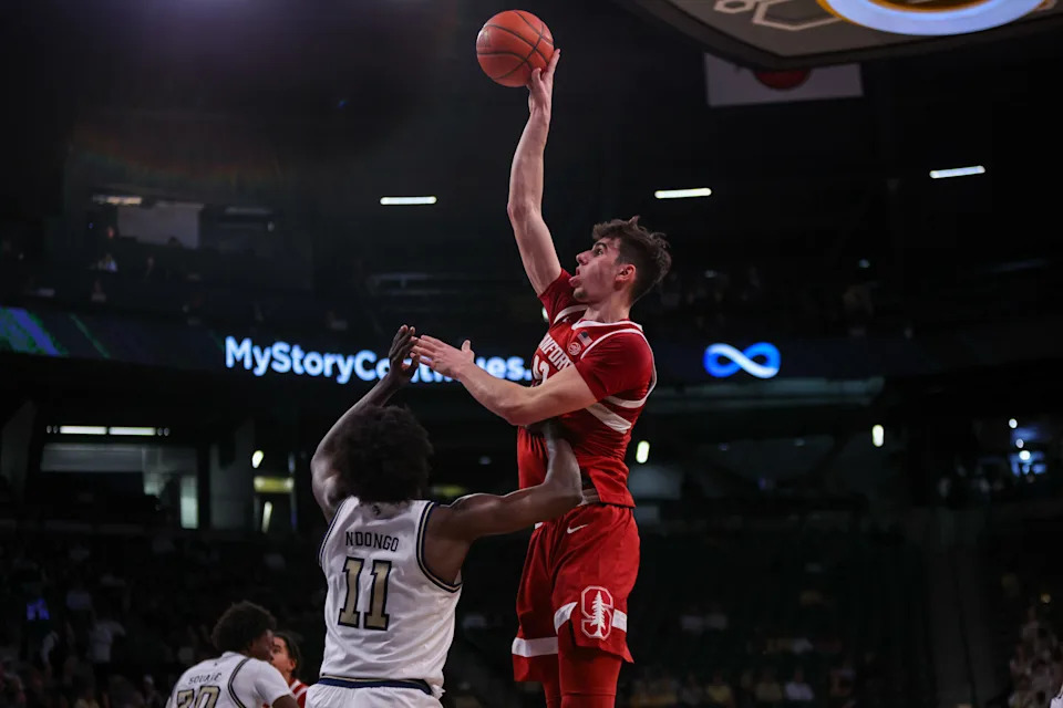 Feb 12, 2025; Atlanta, Georgia, USA; Stanford Cardinal forward Maxime Raynaud (42) shoots over Georgia Tech Yellow Jackets forward Baye Ndongo (11) in the first half at McCamish Pavilion. Mandatory Credit: Brett Davis-Imagn Images