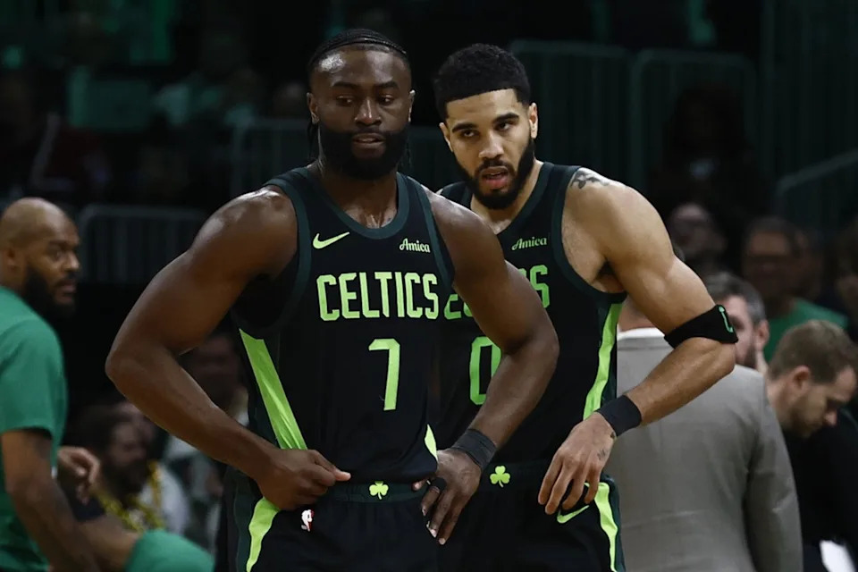 Feb 28, 2025; Boston, Massachusetts, USA; Boston Celtics guard Jaylen Brown (7) and forward Jayson Tatum (0) stand on the court during a timeout during the second half of their loss to the Cleveland Cavaliers at TD Garden. Mandatory Credit: Winslow Townson-Imagn ImagesCredit&colon; Winslow Townson-Imagn Images