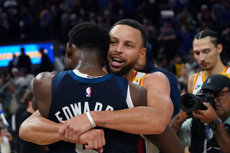 Golden State Warriors guard Stephen Curry (30) hugs Minnesota Timberwolves guard Anthony Edwards (5) at the end of the game at Chase Center.Credit&colon; David Gonzales-Imagn Images