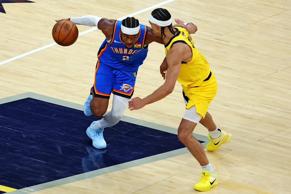 Andrew Nembhard presses Shai Gilgeous-Alexander during Game 3 of the 2025 NBA Finals at Gainbridge Fieldhouse.