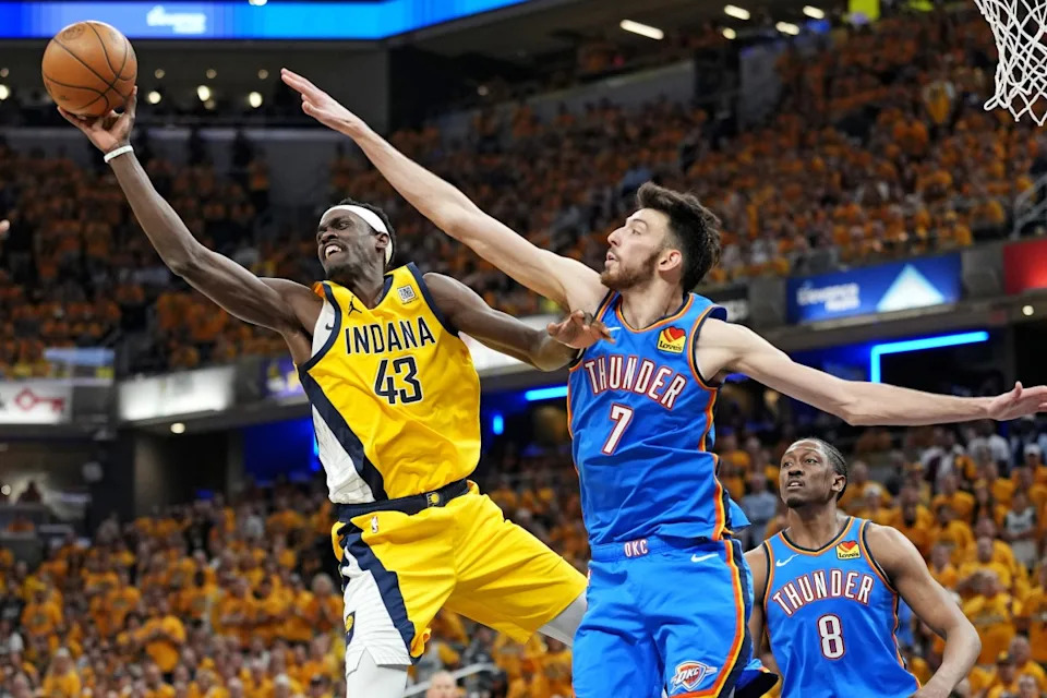 Indiana Pacers forward Pascal Siakam passes the ball as Oklahoma City Thunder forward Chet Holmgren defends during Game 3 of the 2025 NBA Finals at Gainbridge Fieldhouse on June 11, 2025.Kyle Terada-Imagn Images