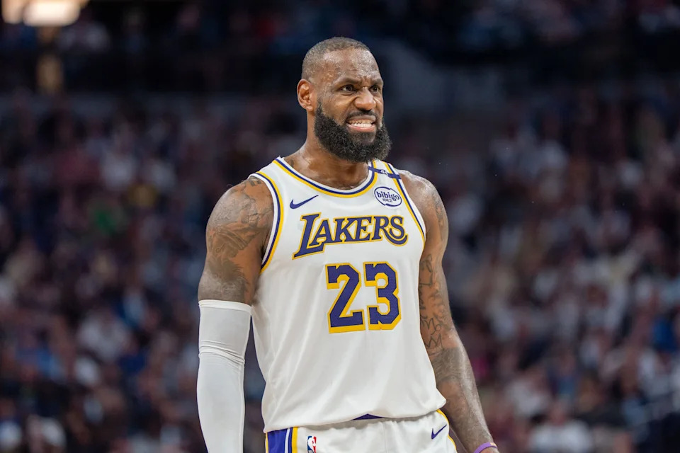 Lakers forward LeBron James talks with a referee in the third quarter at the Minnesota Timberwolves during Game 4 of the first round of the 2025 NBA Playoffs.