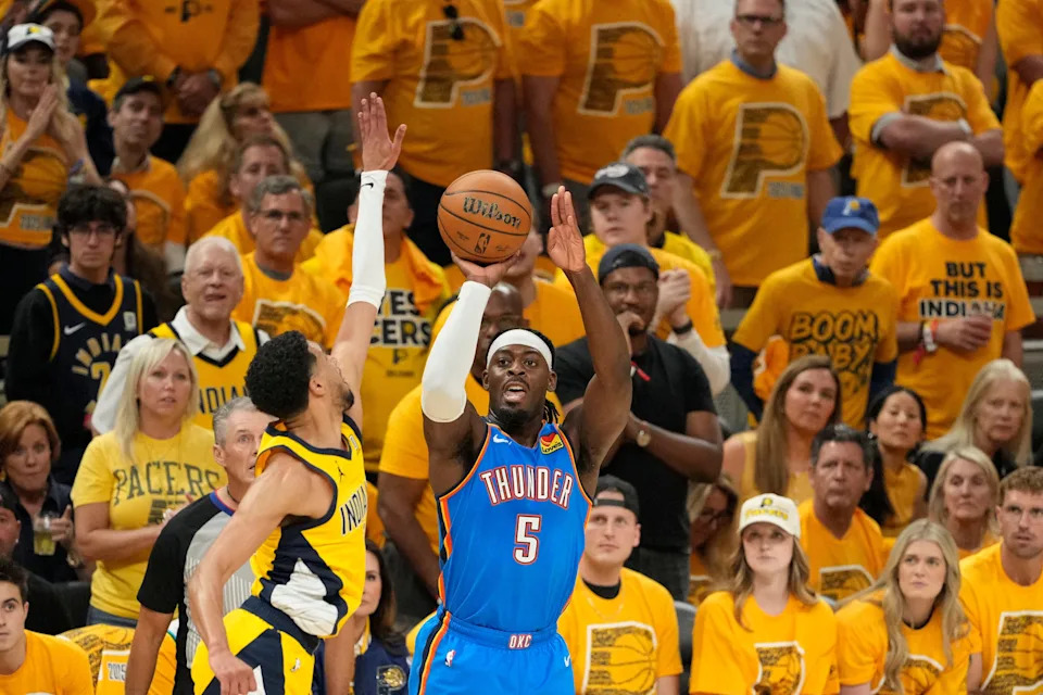 Jun 13, 2025; Indianapolis, Indiana, USA; Oklahoma City Thunder guard Luguentz Dort (5) shoots the ball against Indiana Pacers guard Tyrese Haliburton (0) during the first half during game four of the 2025 NBA Finals at Gainbridge Fieldhouse. Mandatory Credit: Kyle Terada-Imagn Images
