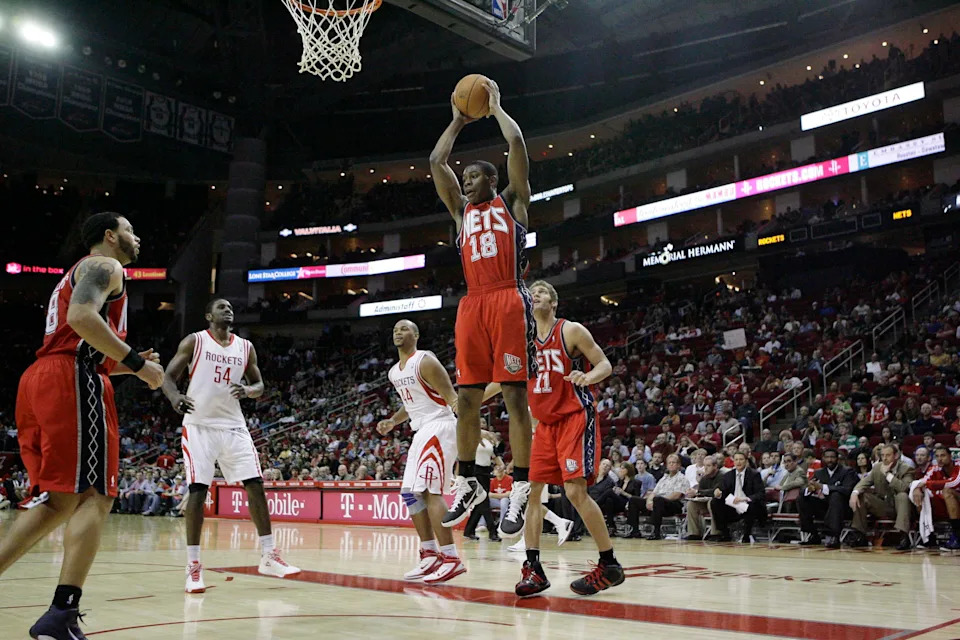 Feb 26, 2011; Houston, TX, USA; New Jersey Nets guard Ben Uzoh (18) gets a rebound against the Houston Rockets in the fourth quarter at the Toyota Center. The Rockets defeated the Nets 123-108. Mandatory Credit: Brett Davis-USA TODAY Sports
