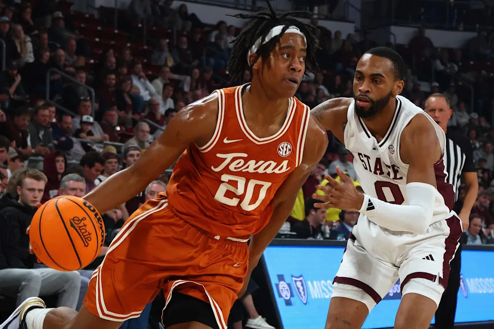 Mar 4, 2025; Starkville, Mississippi, USA; Texas Longhorns guard Tre Johnson (20) drives to the basket as Mississippi State Bulldogs guard Claudell Harris Jr. (0) defends during the first half at Humphrey Coliseum. Mandatory Credit: Petre Thomas-Imagn Images