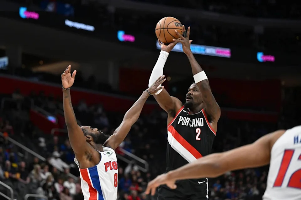 Jan 6, 2025; Detroit, Michigan, USA; Portland Trail Blazers center Deandre Ayton (2) shoots the ball over Detroit Pistons forward Tim Hardaway Jr. (8) in the first quarter at Little Caesars Arena. Mandatory Credit: Lon Horwedel-Imagn Images Mandatory Credit: Lon Horwedel-Imagn Images