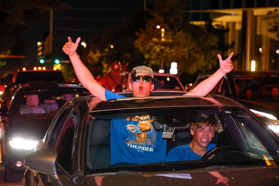 Ecstatic fans celebrate as they leave Game 7 of the NBA Finals, which the Oklahoma City Thunder won against the Indiana Pacers on Sunday, June 22.