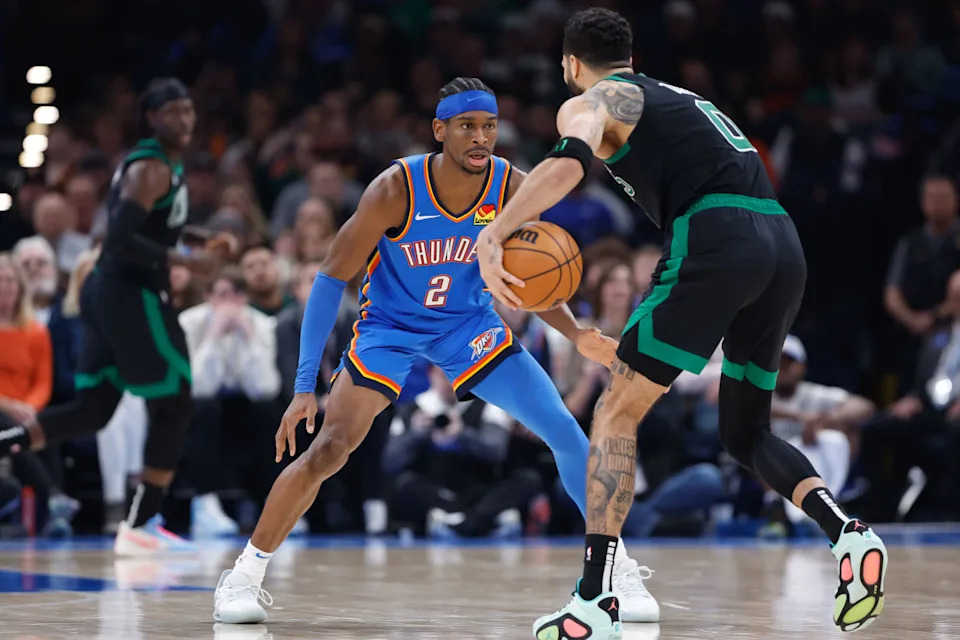 Jan 2, 2024; Oklahoma City, Oklahoma, USA; Oklahoma City Thunder guard Shai Gilgeous-Alexander (2) defends Boston Celtics forward Jayson Tatum (0) during the second quarter at Paycom Center. © Alonzo Adams-Imagn Images