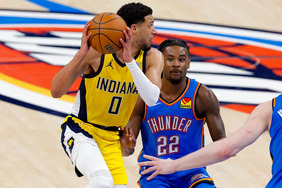 Indiana Pacers guard Tyrese Haliburton looks to pass the ball as Oklahoma City Thunder guard Cason Wallace defends during Game 2 of the 2025 NBA Finals at Paycom Center on June 8, 2025.Alonzo Adams-Imagn Images