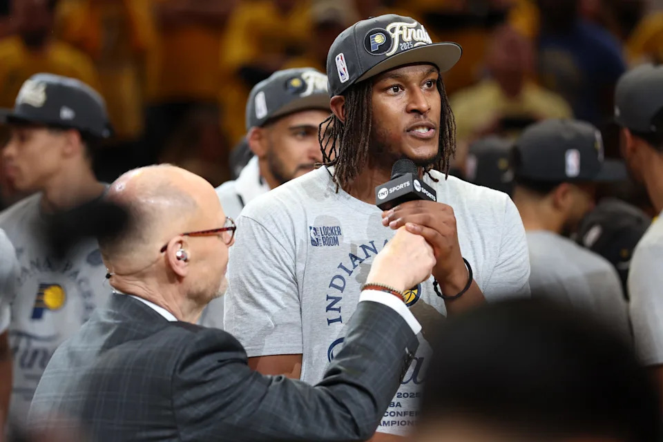 May 31, 2025; Indianapolis, Indiana, USA; Ernie Johnson interviews Indiana Pacers center Myles Turner (33) after game six of the eastern conference finals against the New York Knicks for the 2025 NBA Playoffs at Gainbridge Fieldhouse. Mandatory Credit: Trevor Ruszkowski-Imagn Images